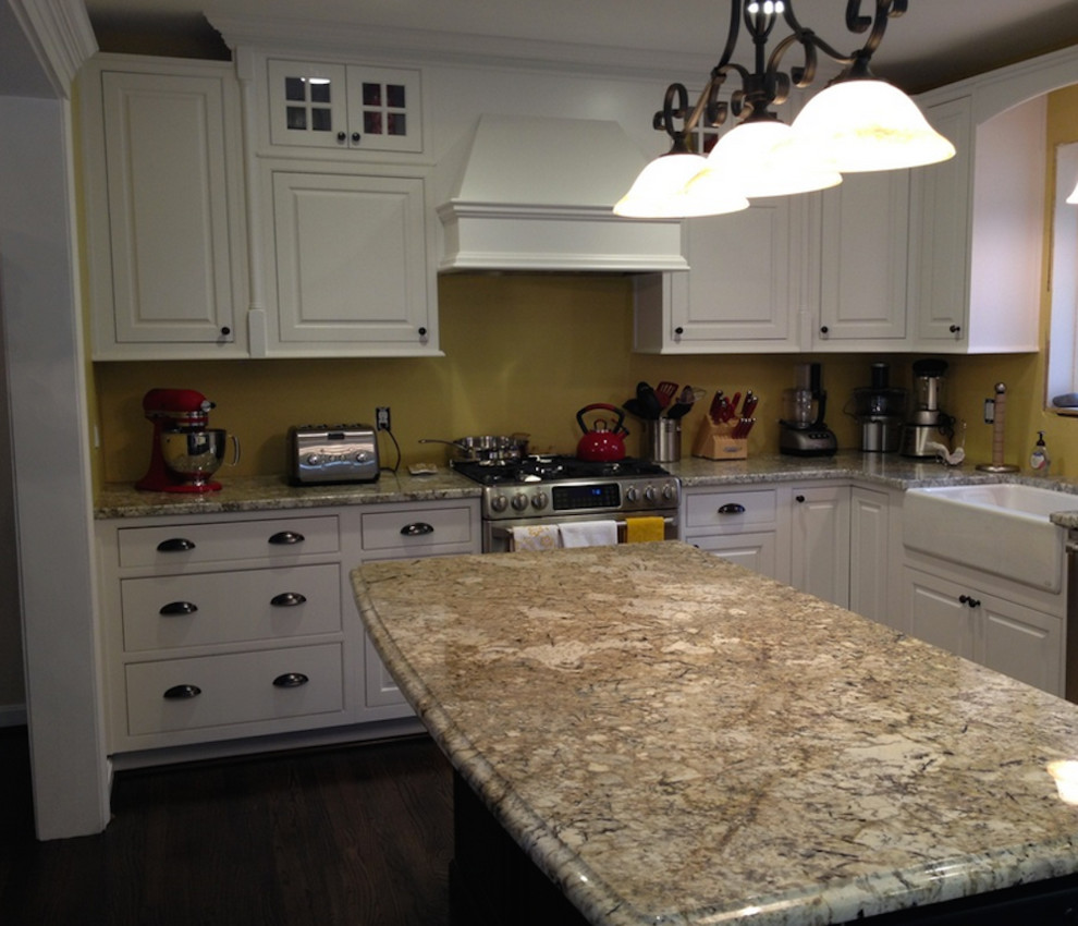 Eat-in kitchen - large u-shaped dark wood floor eat-in kitchen idea in DC Metro with a farmhouse sink, raised-panel cabinets, white cabinets, granite countertops, stainless steel appliances and an island