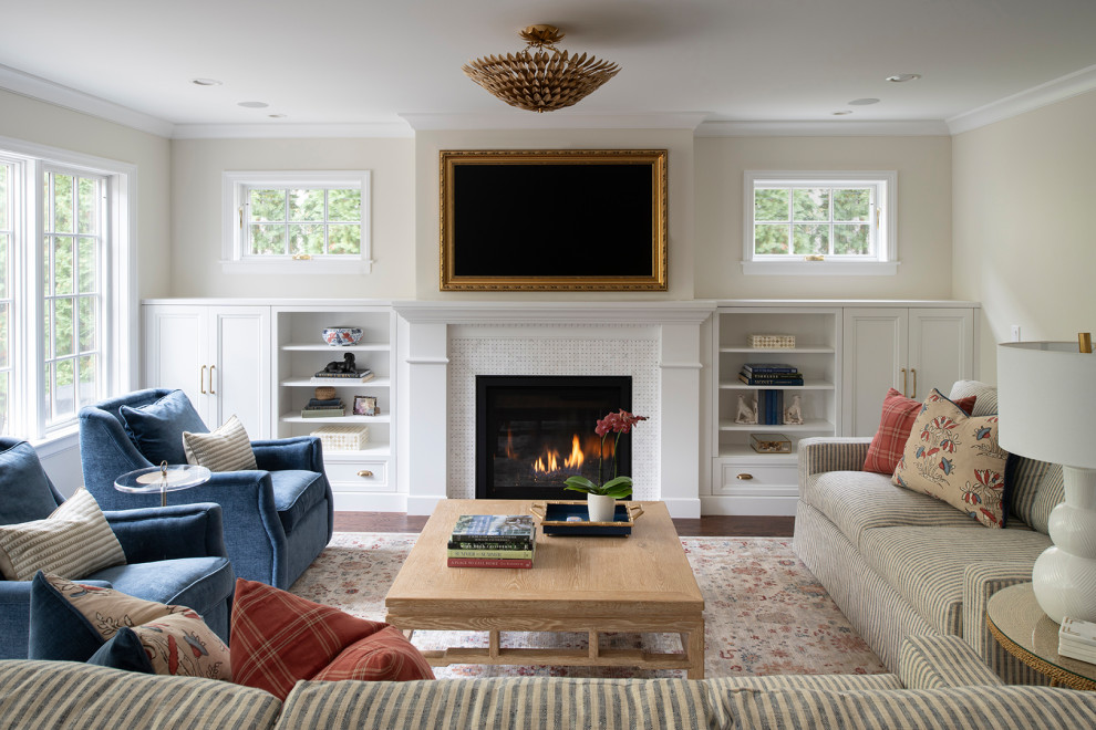 Inspiration for a large transitional formal open concept living room in Minneapolis with beige walls, dark hardwood floors, a standard fireplace, a tile fireplace surround, a wall-mounted tv and brown floor.