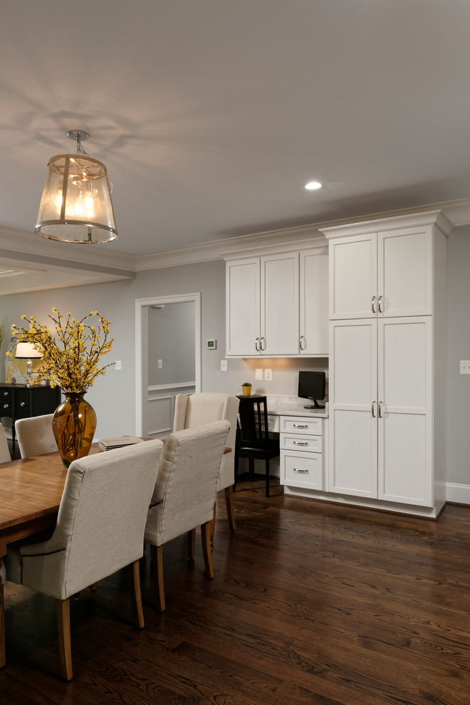 Inspiration for a large transitional u-shaped open plan kitchen in DC Metro with a single-bowl sink, flat-panel cabinets, white cabinets, grey splashback, stone tile splashback, stainless steel appliances, dark hardwood floors and with island.