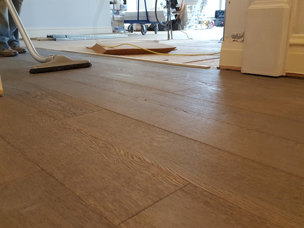 5 and 3/4 inch engineered Bed Rock Oak trowel glued and nailed