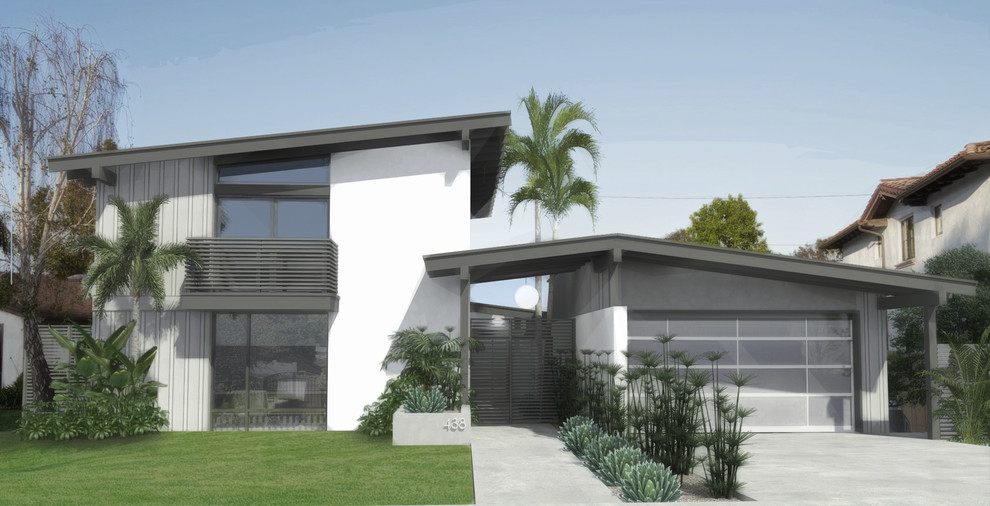 This is an example of a mid-sized midcentury two-storey stucco white exterior in Los Angeles with a hip roof.