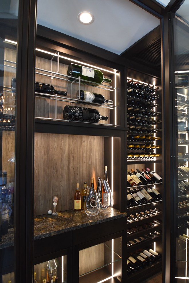 Wine cellar - large contemporary medium tone wood floor wine cellar idea in Orange County