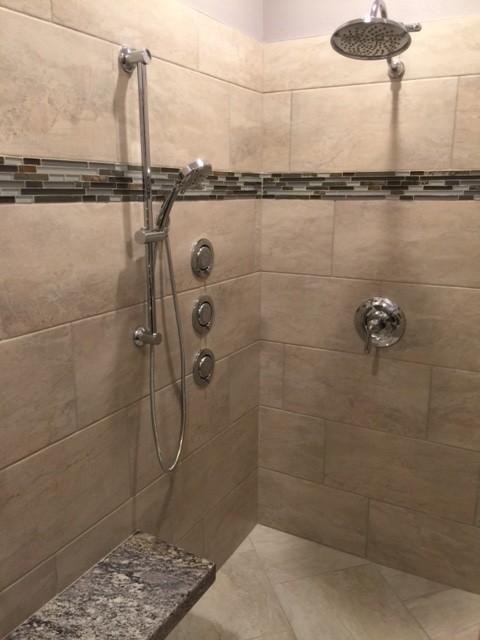 Inspiration for a mid-sized transitional master multicolored tile and mosaic tile ceramic tile and beige floor doorless shower remodel with raised-panel cabinets, white cabinets, a two-piece toilet, gray walls, a vessel sink and granite countertops