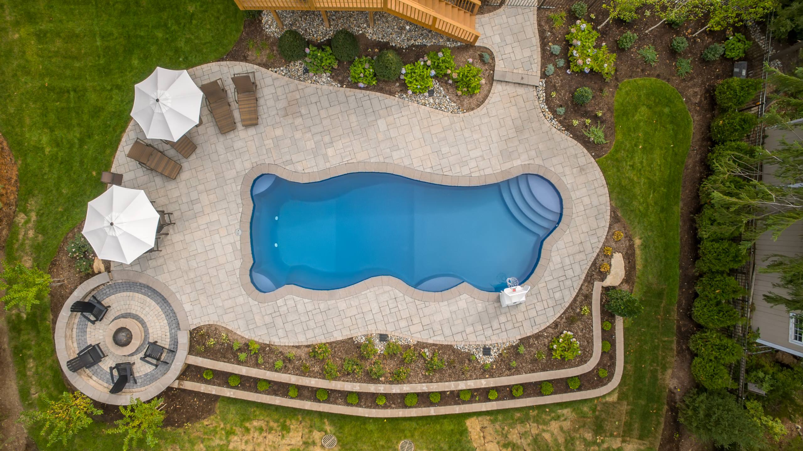 Creating a pool area on a sloped backyard