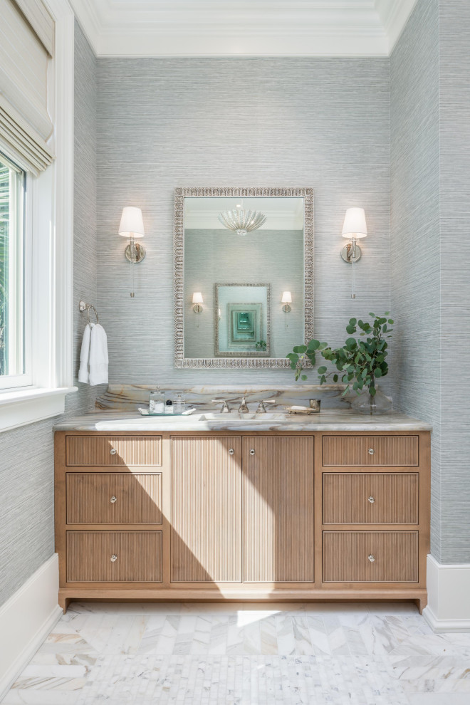 Inspiration for a nautical bathroom in Charleston with brown cabinets and a built in vanity unit.