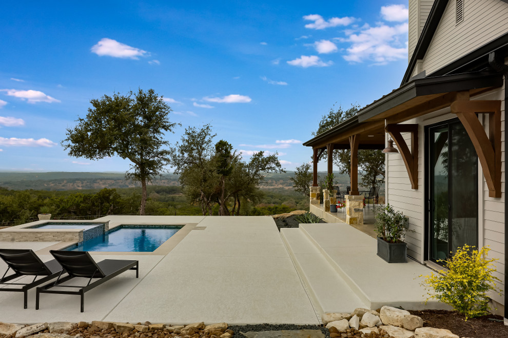 Pool landscaping - cottage backyard lap pool landscaping idea in Austin