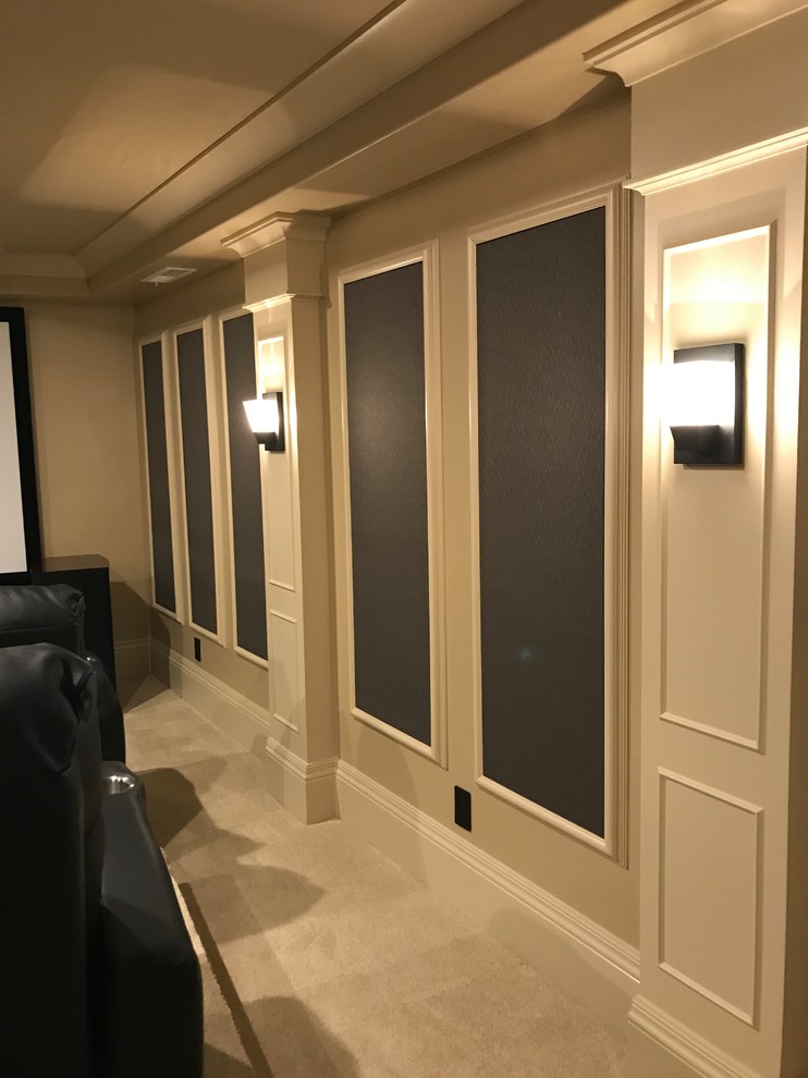 Large traditional enclosed home theatre in Salt Lake City with grey walls, carpet, a built-in media wall and beige floor.