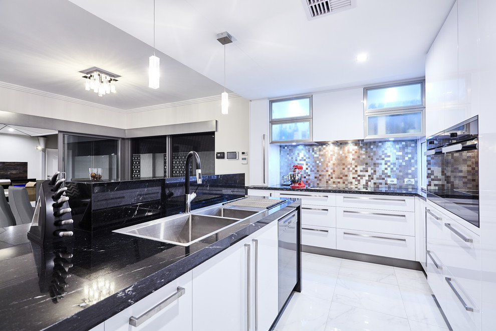 Contemporary l-shaped eat-in kitchen in Perth with a double-bowl sink, flat-panel cabinets, white cabinets, metallic splashback, stainless steel appliances and with island.