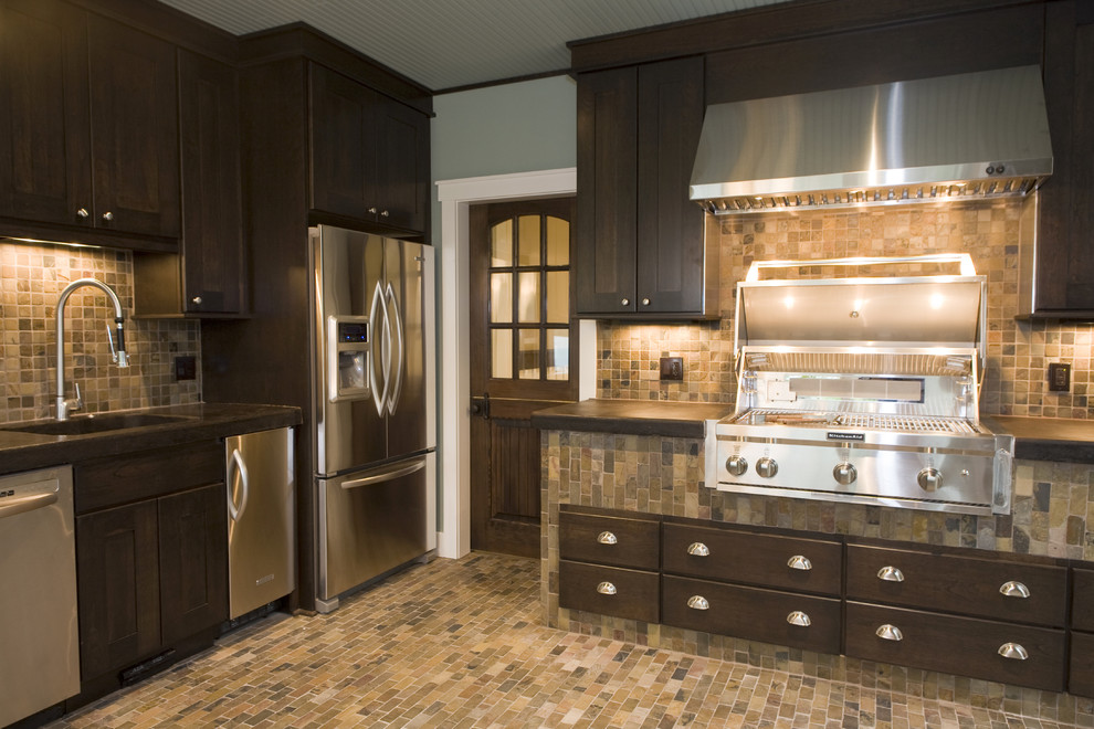 Arts and crafts kitchen in Other with stainless steel appliances.