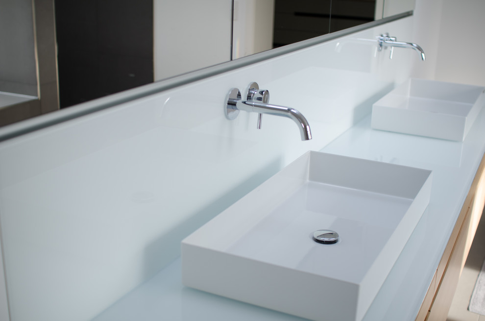 Design ideas for a contemporary bathroom in Dusseldorf with flat-panel cabinets, light wood cabinets, white walls, wood benchtops, grey floor and white benchtops.