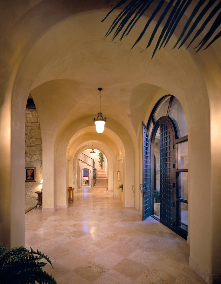 Design ideas for a mediterranean foyer in Austin with beige walls, a double front door and a black front door.