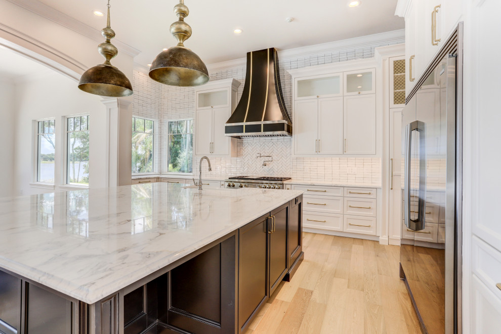 This is an example of a transitional kitchen in Orlando with shaker cabinets, white cabinets, granite benchtops, with island and orange benchtop.