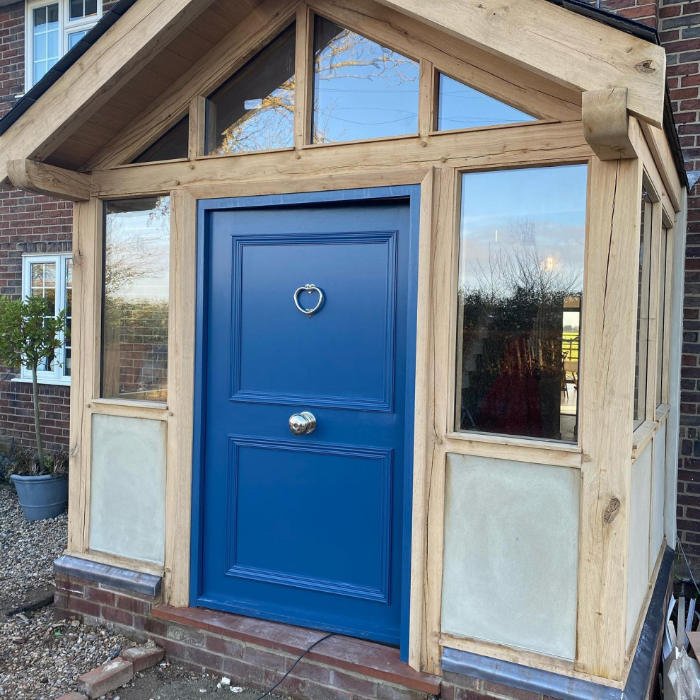 This is an example of a large classic front door in Essex with a single front door and a blue front door.