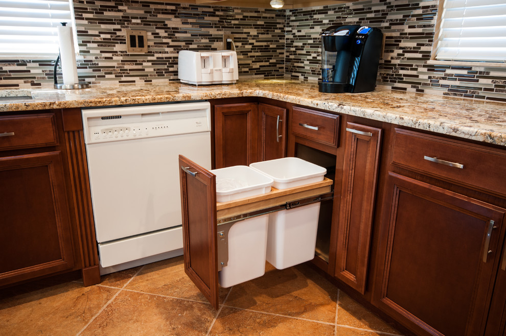 Example of a large transitional u-shaped ceramic tile enclosed kitchen design in Tampa with an undermount sink, recessed-panel cabinets, dark wood cabinets, granite countertops, multicolored backsplash, subway tile backsplash, white appliances and an island