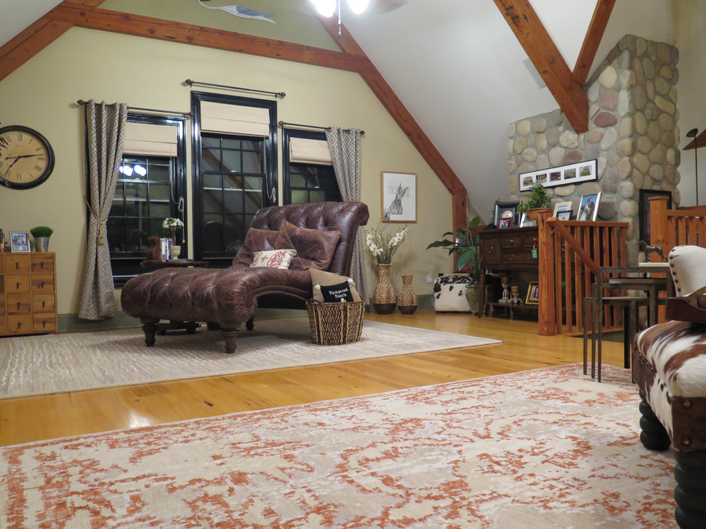 Large mountain style loft-style light wood floor home design photo in Bridgeport with no tv, beige walls and no fireplace