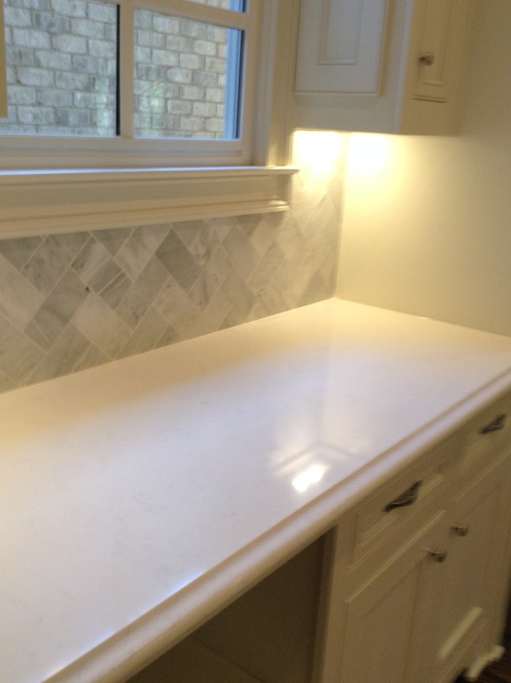 Example of a transitional kitchen design in Atlanta with a single-bowl sink, quartz countertops, gray backsplash and stone tile backsplash