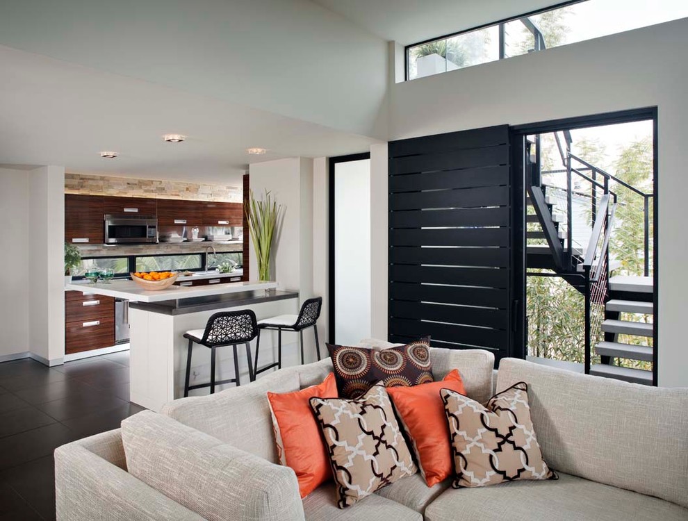 Inspiration for a large modern open concept family room in San Diego with beige walls and a wall-mounted tv.