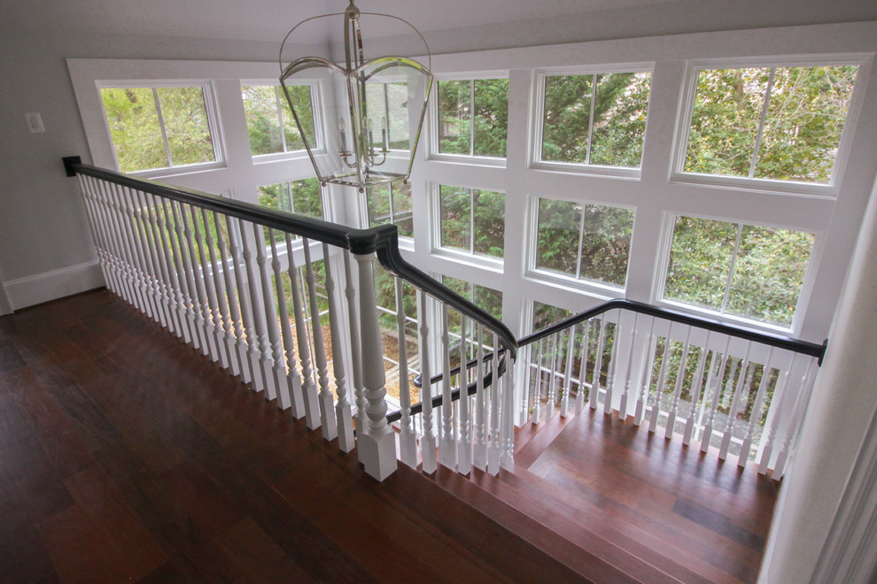 Inspiration for a large transitional wooden floating wood railing staircase remodel in DC Metro with wooden risers