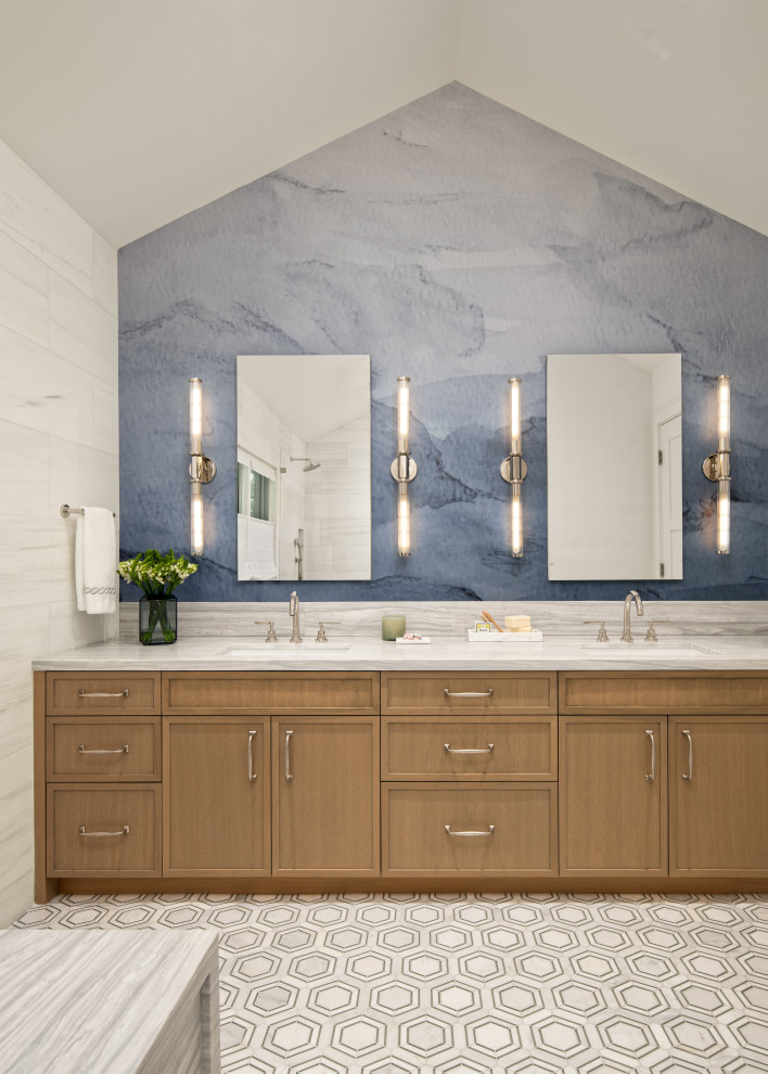 Inspiration for a transitional master bathroom in San Francisco with shaker cabinets, medium wood cabinets, marble floors, an undermount sink, marble benchtops, a double vanity, a built-in vanity, wallpaper and vaulted.