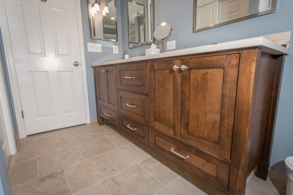 Inspiration for a mid-sized transitional beige tile and porcelain tile porcelain tile bathroom remodel in DC Metro with an undermount sink, flat-panel cabinets, dark wood cabinets, quartz countertops, a two-piece toilet and blue walls