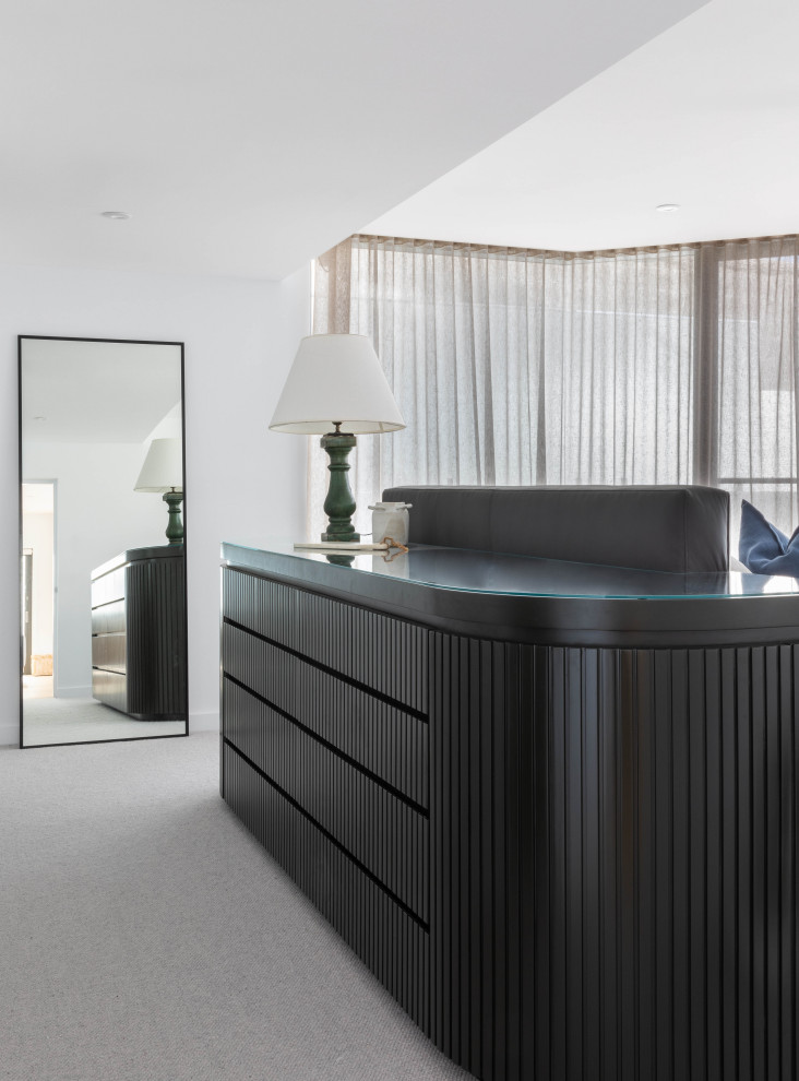 This is an example of a mid-sized contemporary bedroom in Sydney.