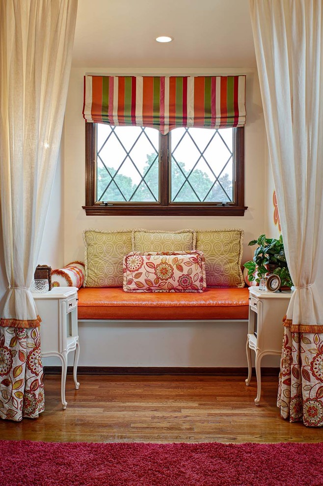Eclectic teen room in New York with beige walls and medium hardwood floors for girls.