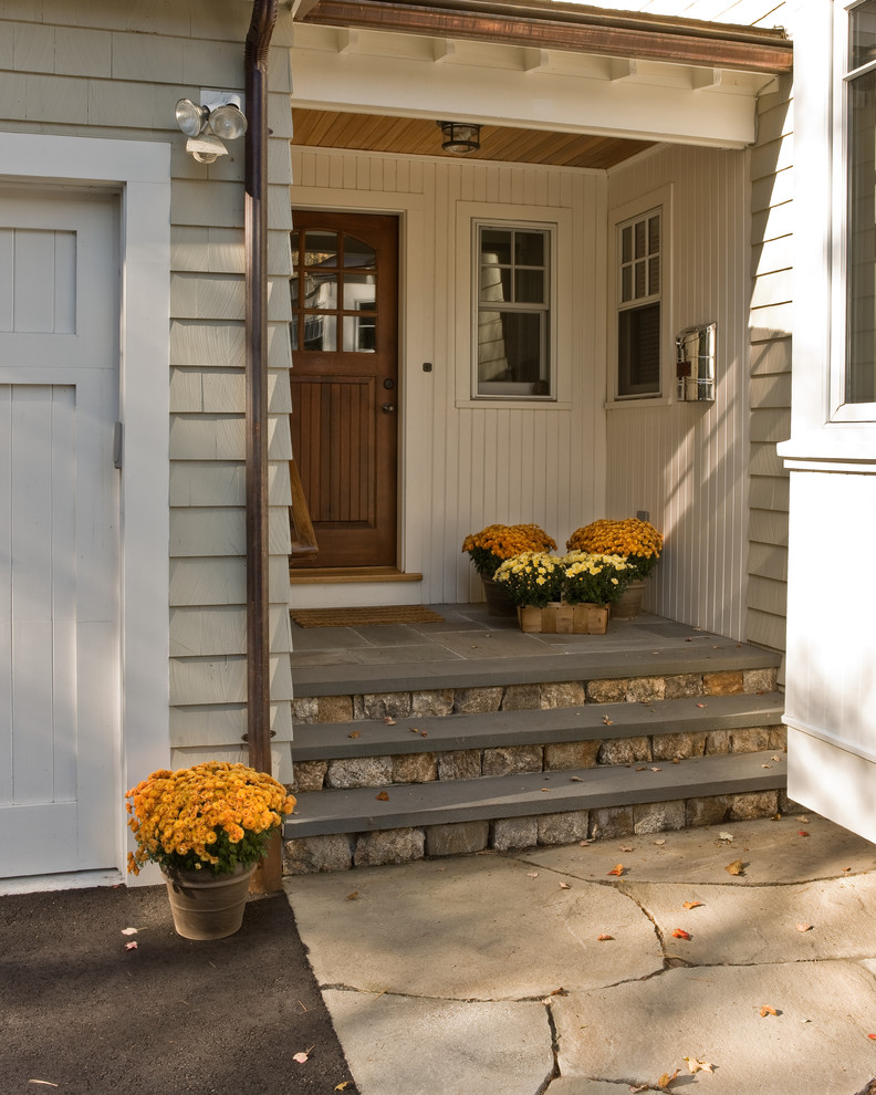 This is an example of a traditional entryway in Boston with ceramic floors.