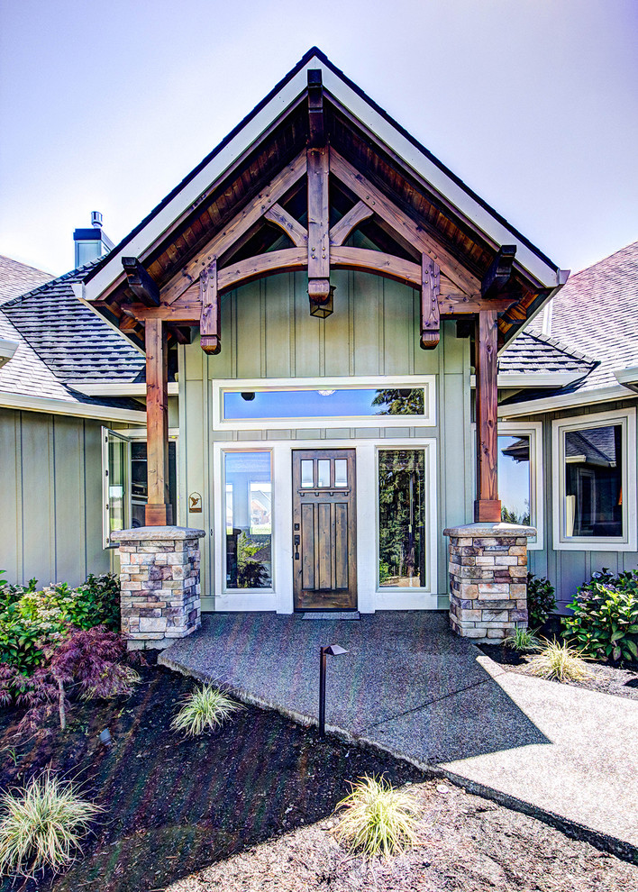 Photo of a traditional front door in Portland with a single front door and a dark wood front door.