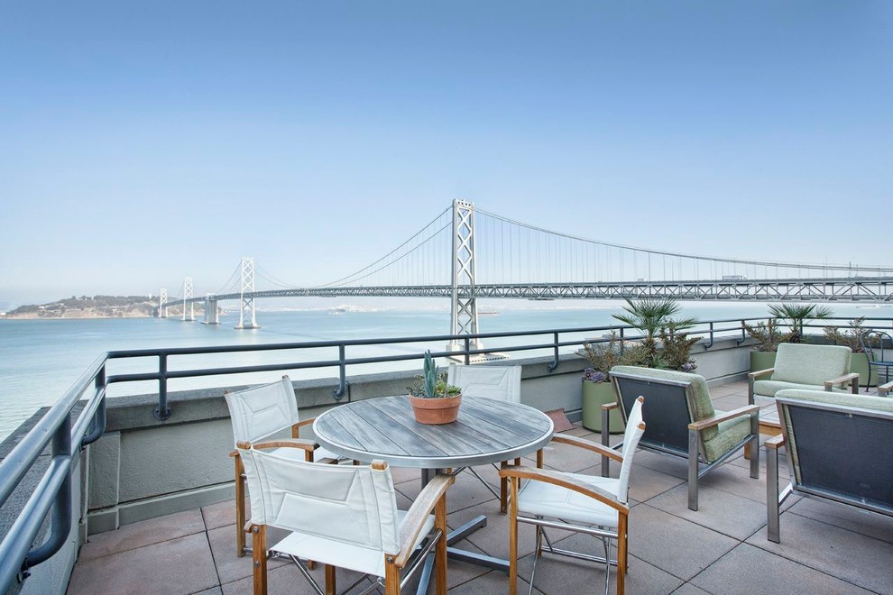 Huge trendy backyard deck photo in San Francisco with no cover