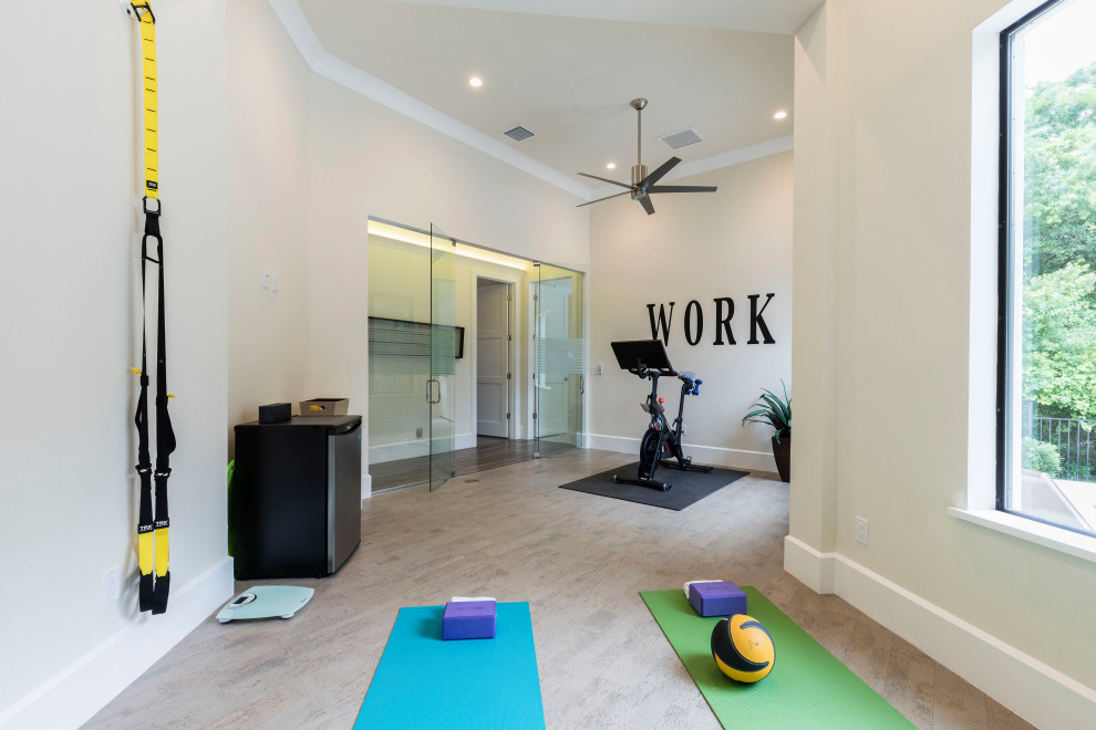 Design ideas for a mid-sized modern multipurpose gym in Orlando with beige walls, cork floors and beige floor.