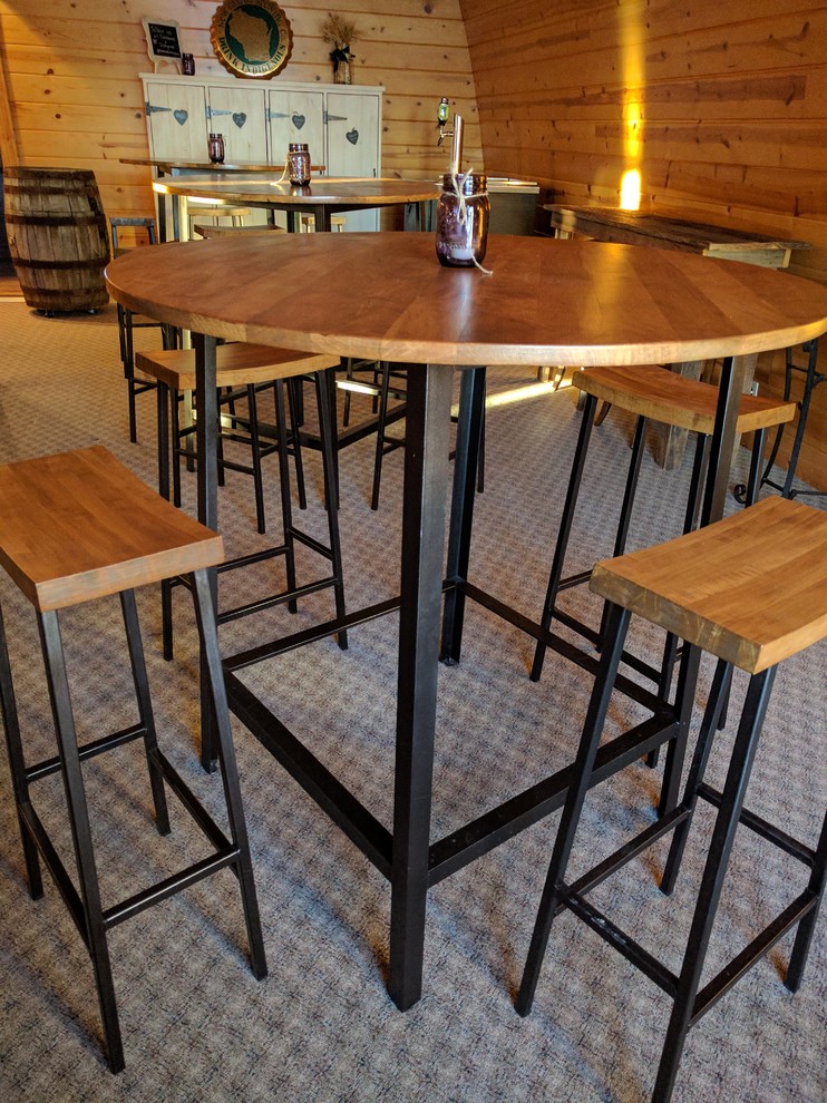 Example of a mountain style dining room design with brown walls
