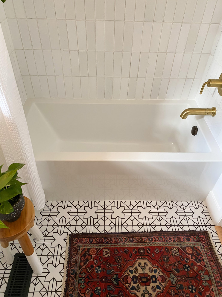 This is an example of a mid-sized eclectic master bathroom in Portland with dark wood cabinets, an alcove tub, a shower/bathtub combo, white tile, ceramic tile, white walls, ceramic floors, white floor, a shower curtain, white benchtops, a niche and a single vanity.