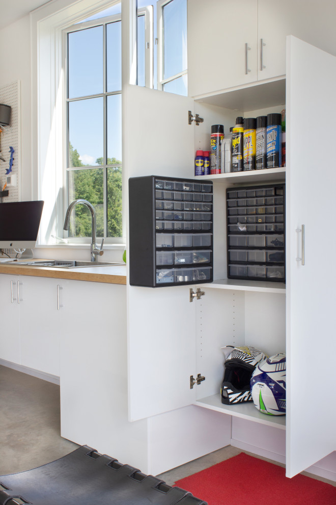 Inspiration for a large contemporary attached two-car garage remodel in New York