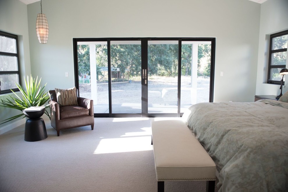 Mid-sized country master bedroom in Sacramento with white walls, carpet and beige floor.