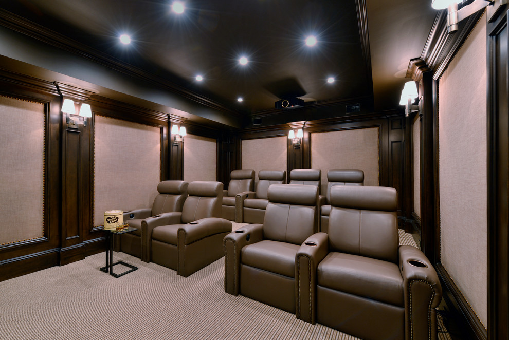 Small traditional enclosed home theatre in New York with brown walls, carpet, multi-coloured floor and a projector screen.