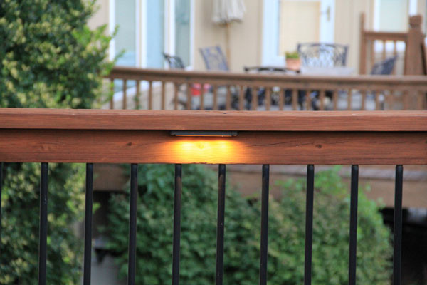 Deck lighting using low under railing LED lights american-traditional-terrace