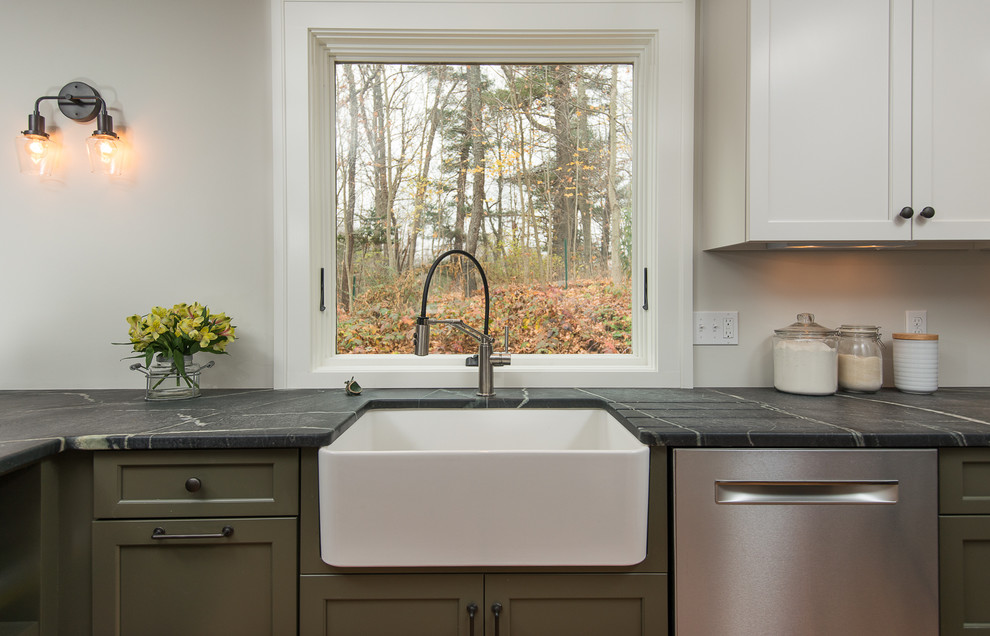Inspiration for a mid-sized transitional l-shaped eat-in kitchen remodel in Boston with recessed-panel cabinets, green cabinets, soapstone countertops, white backsplash, subway tile backsplash, stainless steel appliances and a peninsula