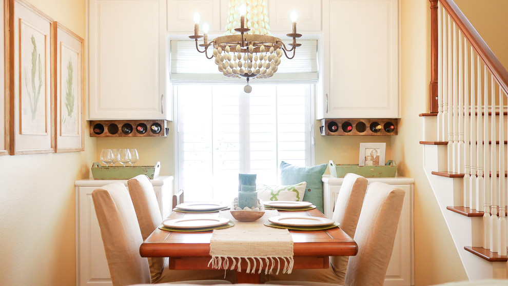 Photo of a small country dining room in San Diego with beige walls.