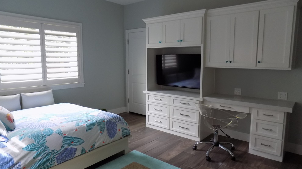 This is an example of a mid-sized modern bedroom in San Luis Obispo with multi-coloured walls and ceramic floors.