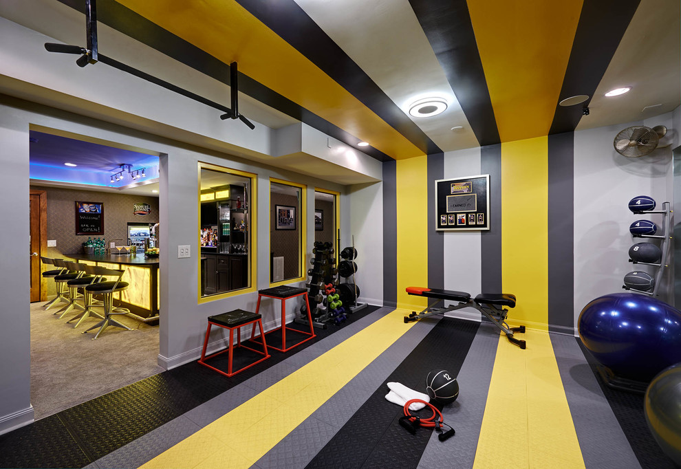 This is an example of a contemporary home weight room in Charlotte with multi-coloured walls and multi-coloured floor.