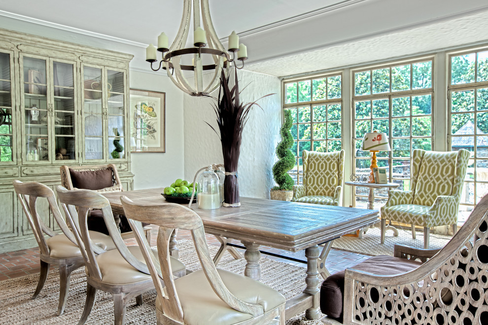 Traditional dining room in Charlotte with brick floors.