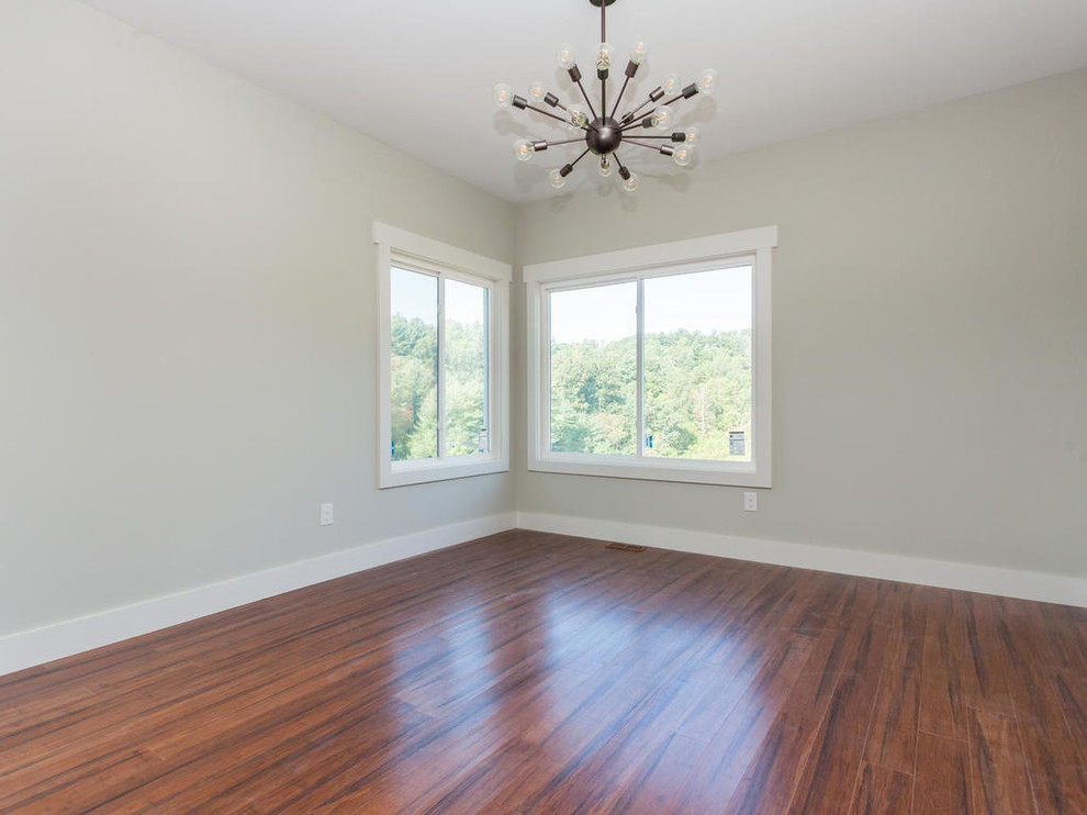 Mid-sized transitional master bedroom in Other with grey walls, medium hardwood floors and no fireplace.