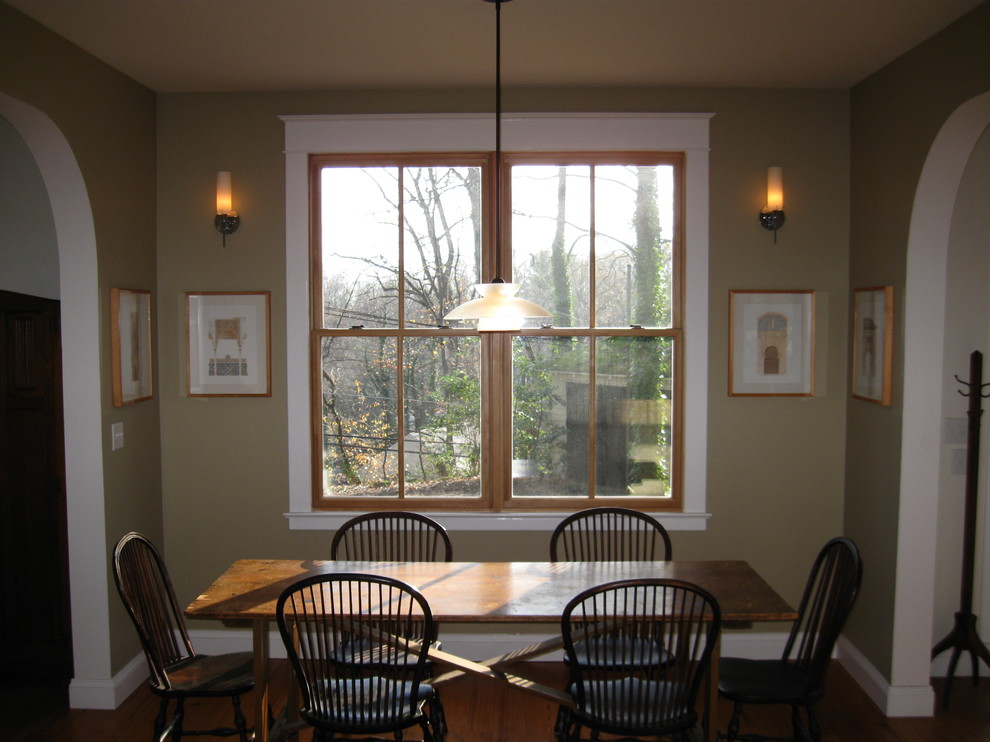 Photo of a mid-sized arts and crafts open plan dining in Baltimore with beige walls and medium hardwood floors.