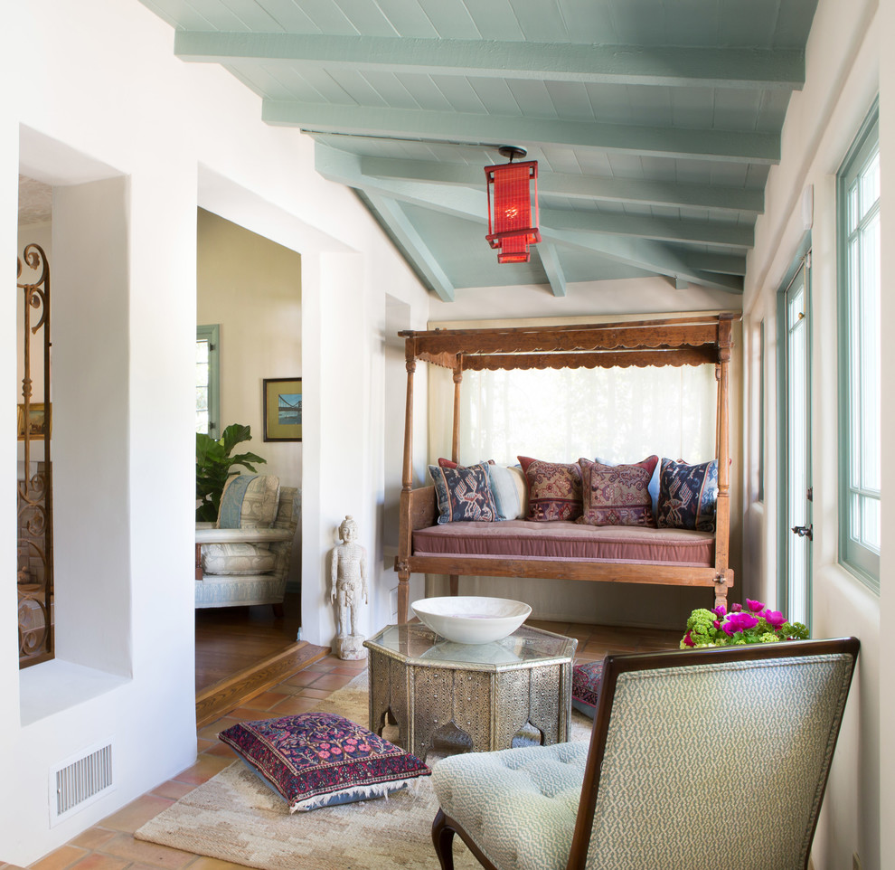 Design ideas for a mediterranean sunroom in Los Angeles with a standard ceiling and terra-cotta floors.