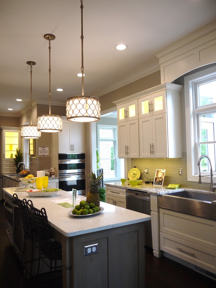 Design ideas for a large transitional galley separate kitchen in Grand Rapids with a farmhouse sink, recessed-panel cabinets, white cabinets, quartz benchtops, grey splashback, stainless steel appliances, dark hardwood floors and with island.