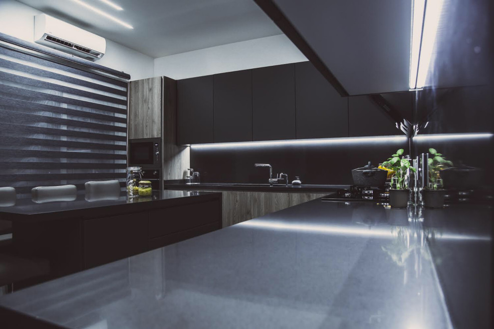 Inspiration for a large modern l-shaped ceramic tile and gray floor kitchen remodel with a double-bowl sink, flat-panel cabinets, quartzite countertops, gray backsplash, stainless steel appliances, an island and gray countertops