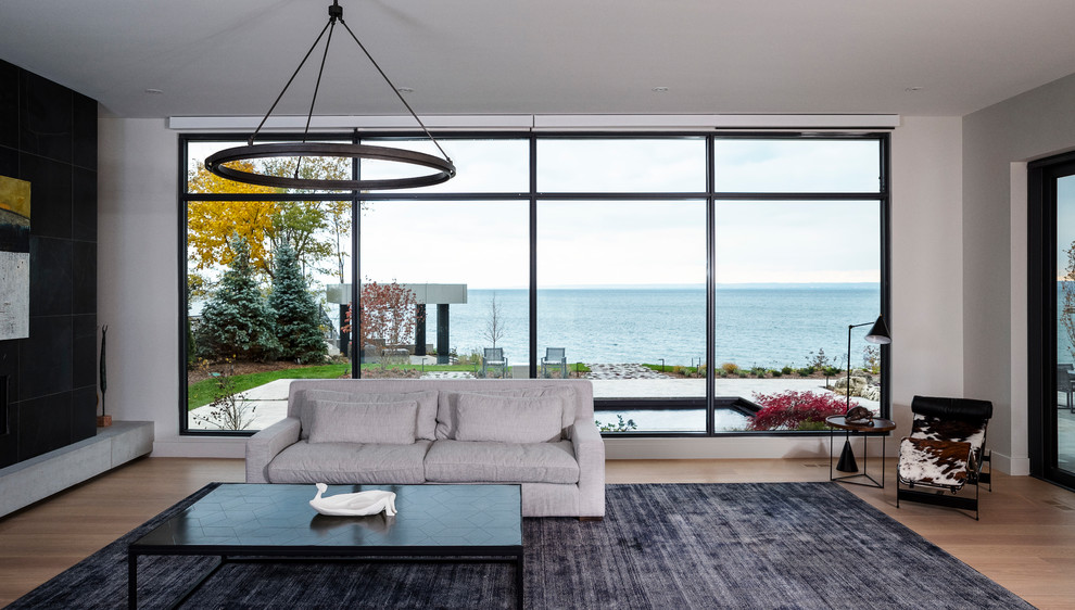 This is an example of a large contemporary family room in Toronto.