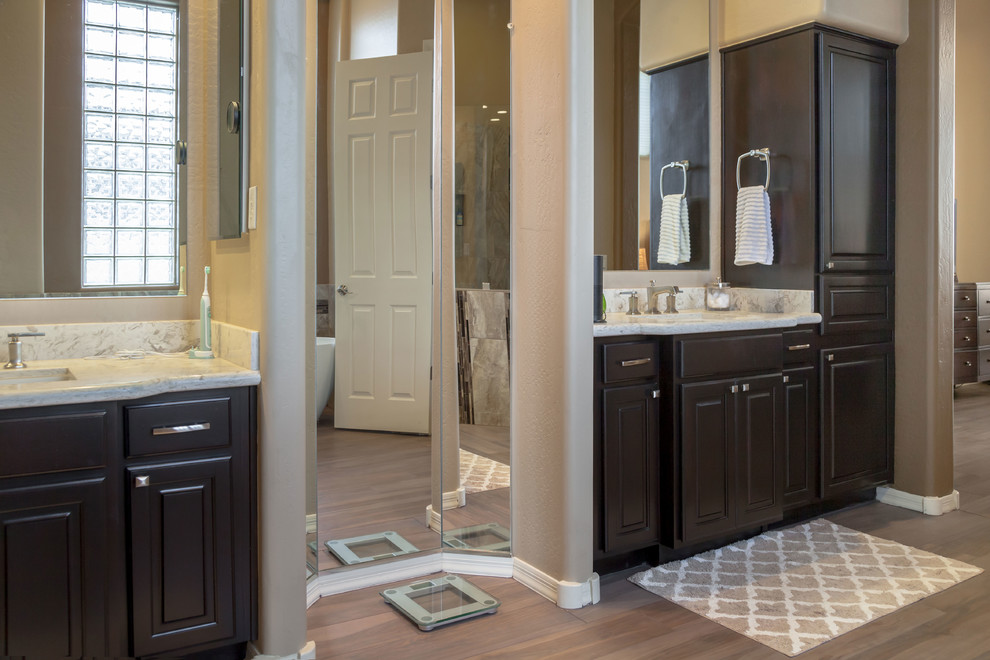 Mid-sized transitional master brown tile porcelain tile bathroom photo in Phoenix with recessed-panel cabinets, brown cabinets, beige walls, an undermount sink and quartz countertops