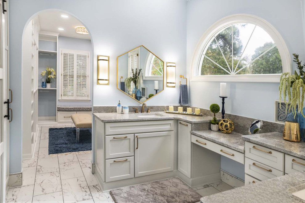 This is an example of a large transitional master bathroom in Atlanta with flat-panel cabinets, grey cabinets, a curbless shower, a two-piece toilet, blue walls, ceramic floors, granite benchtops, white floor, an open shower, grey benchtops, a shower seat, a single vanity, a built-in vanity, vaulted and an undermount sink.