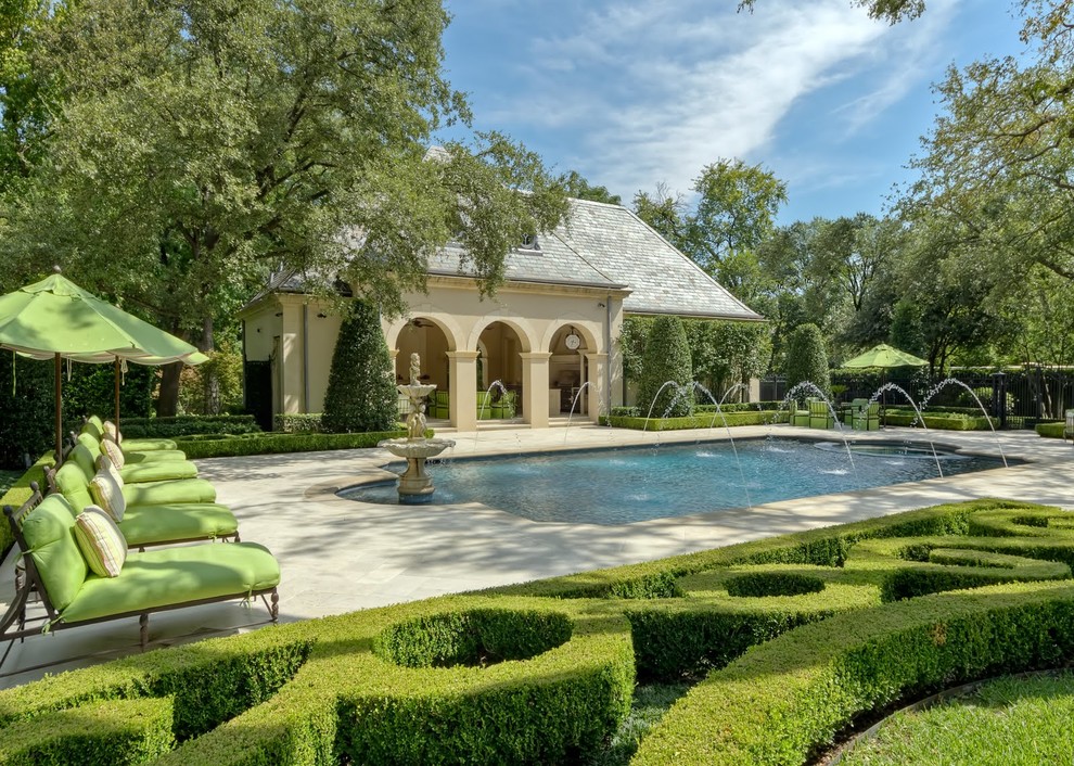 Inspiration for a traditional rectangular pool in Dallas with a water feature.